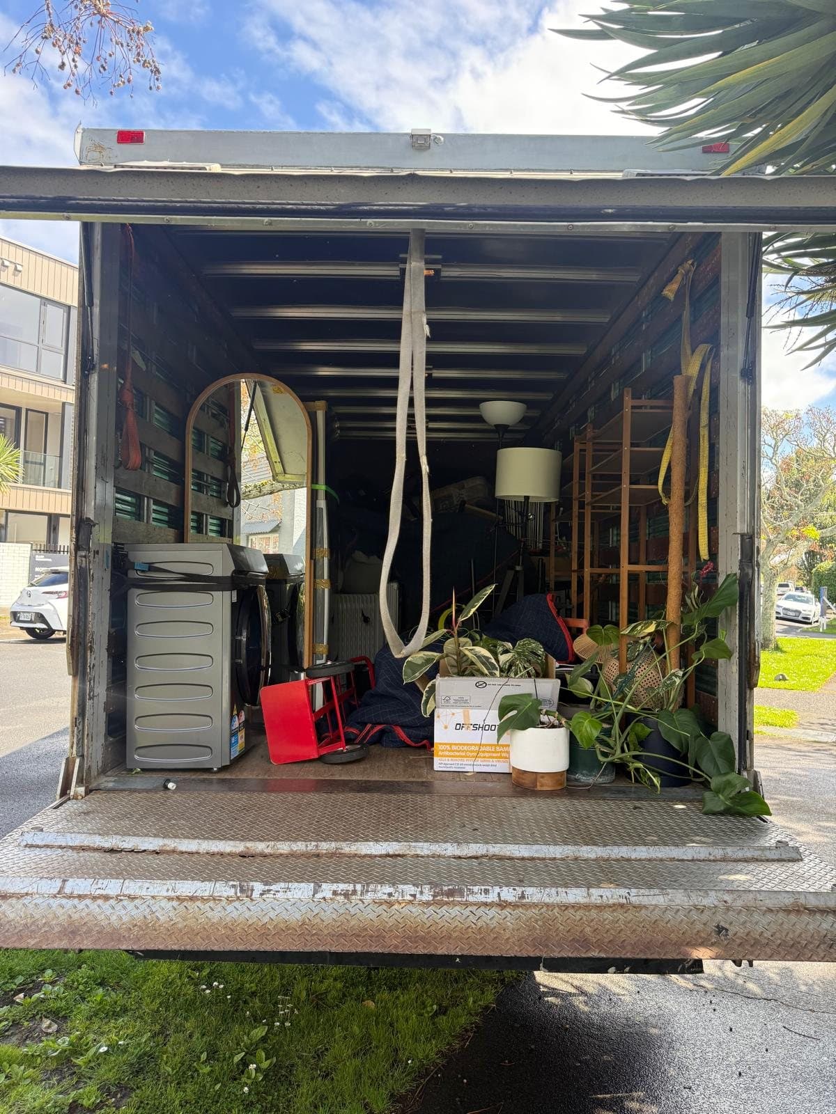 Truck loaded and ready to go — appliances, furniture and plants